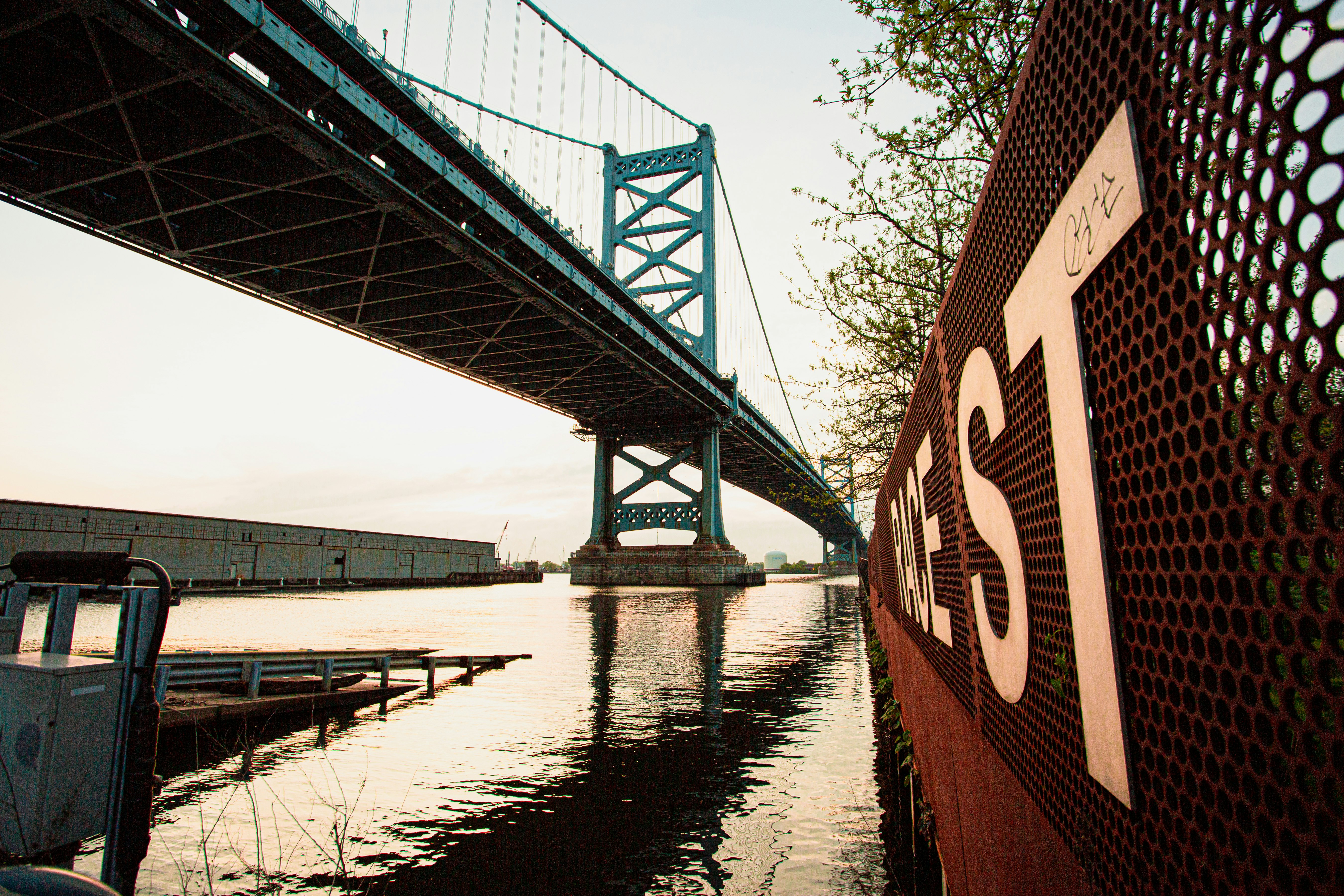 brown and white bridge over river during daytime